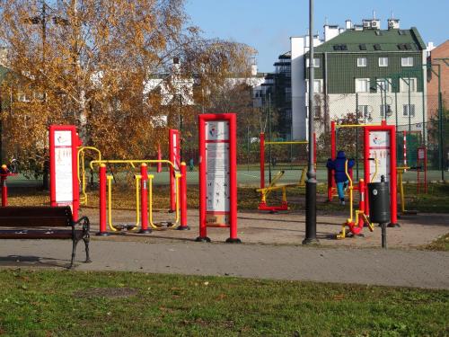 a playground with red booths in a park at Zenhouse apartament Warszawa Ursynów, Mokotów wynajem krótkoterminowy, noclegi in Warsaw