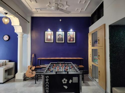 a room with a table with a chess board on it at Bed N Banter - Lucknow in Lucknow