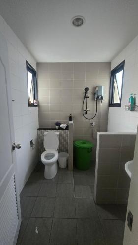 a bathroom with a toilet and a shower and a sink at joyful House Naiyang 238 in Nai Yang Beach
