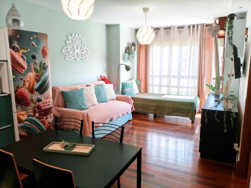 a living room with a couch and a table at Flor de Lis in Medina de Pomar