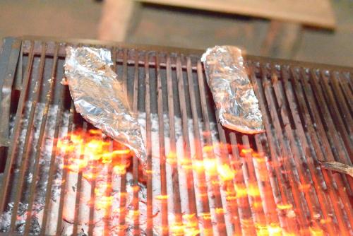 two hot dogs are cooking on a grill at Yala Dream Park in Yala