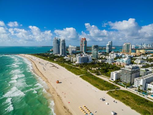 an aerial view of a beach and the ocean at Dream Destinations at Ocean Place in Miami Beach