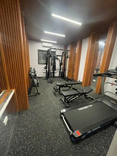 a room with a gym with treadmills and a treadmill at San Hotel & Pool in Hanoi