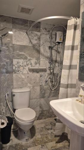 a bathroom with a toilet and a sink at PB326 Beautiful studio in Phuket in Ban Mai Salae