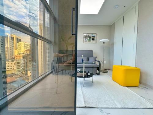 a living room with a view of a city at The Comfort in Seoul