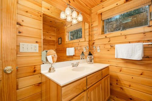 a bathroom with a sink and a mirror at A Wispful Dream in McHenry