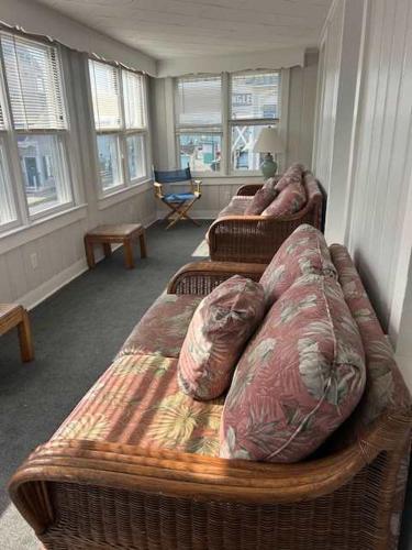 two wicker beds in a room with windows at OCHG 306 Talbot Top in Ocean City