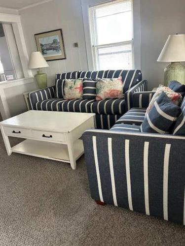 a living room with two couches and a coffee table at OCHG 306 Talbot Top in Ocean City