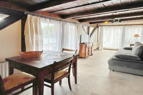 a living room with a table and a couch at Altstadtflair - Rüster in Lübbenau
