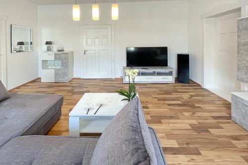 a living room with a couch and a tv at Malve in Lübbenau