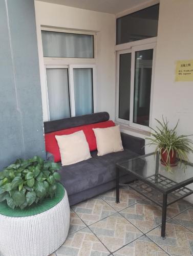a living room with a couch and a table at LETE Hostel in Xining