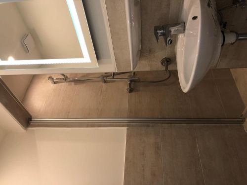 a bathroom with a sink and a mirror at Seaside-Amrum-18 in Norddorf