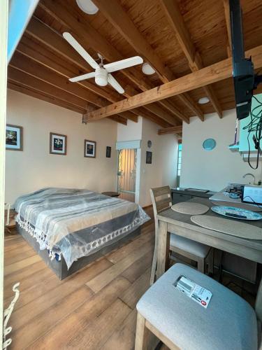 a bedroom with a bed and a wooden ceiling at Loft en Condesa in Mexico City