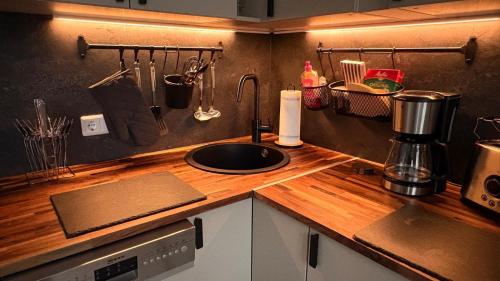 a kitchen with a counter top with a sink at Apartment Baltica in Rostock