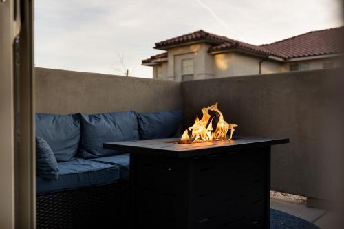 a fire pit in front of a blue couch at Pool, lazy river, pickle ball, sleeps 14, fire pit in Washington