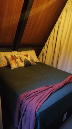 a bed in a room with a canopy at Cabana Quintal in Aquidauana