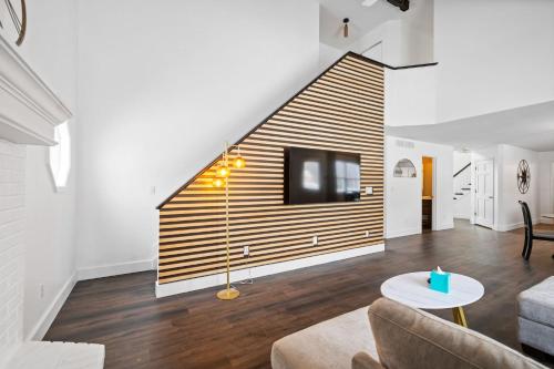 a living room with a couch and a tv at Nookside Grand Estate For 8 in Hamilton