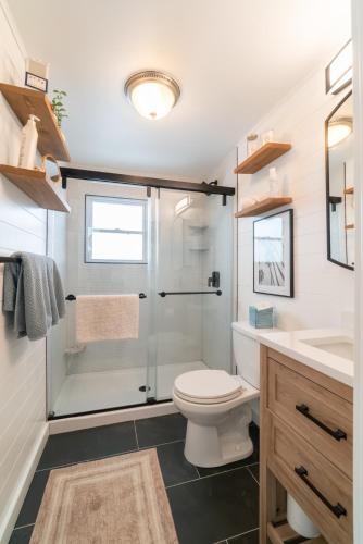 a bathroom with a shower and a toilet and a sink at Ocean City 2BR Condo in Ocean City