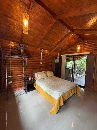 a bedroom with a bed and a wooden ceiling at Nature retreat in Río Cuarto