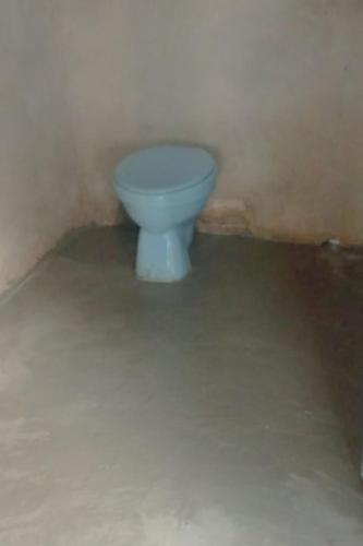 a bathroom with a white toilet in a room at Yefnabi Homestay in Yeben