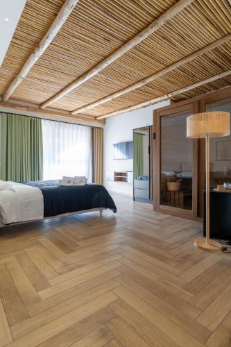 a bedroom with a bed and a large window at SHAH Rooms&relax in Taranto