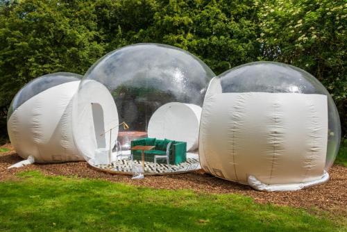 a group of domes with a train inside at Grand bubble in Kent