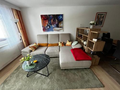 a living room with a couch and a table at Ferienwohnung Schöne Aussicht in Todtmoos