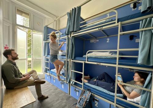 a group of people in a room with bunk beds at Smart Hyde Park Inn in London