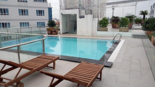 a swimming pool on the roof of a building at Ciao SaiGon Hotel & Spa in Ho Chi Minh City