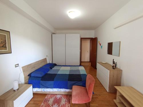 a bedroom with a bed and a desk and a chair at Il nido Perugia in Perugia