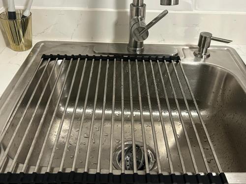 a sink with a metal grate in it at Private Oakland Hills Guest Apartment in Oakland