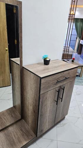 a wooden counter with a bowl on top of it at Juliana Beach Hurghada in Hurghada
