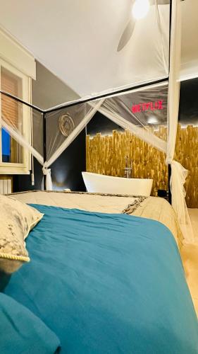 a bedroom with a bed with a tub and a sink at Esclusive Spa Suite in Comacchio