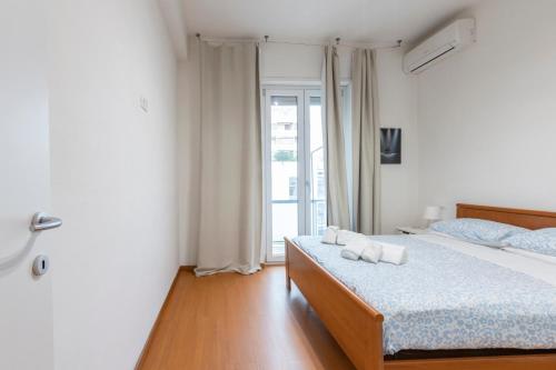 a bedroom with a bed with two towels on it at Pescara Centro sul Mare in Pescara