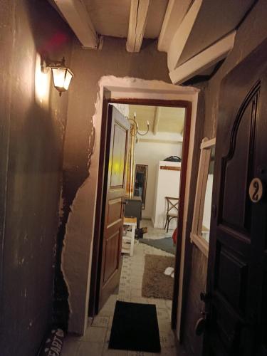 a hallway with a wall that is being remodeled at Αγρόκτημα Agrikia Σπίτι in Arachova