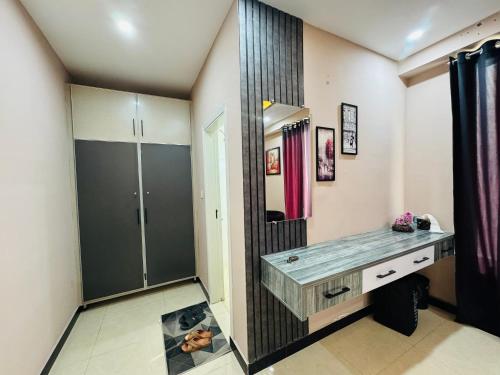 a bathroom with a sink and a mirror at Stay Homie - 1BHK, Near ISB Airport, Self Check-In, Secure in Islamabad