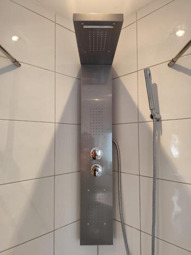 a shower with a shower head in a bathroom at Ferienwohnungen Recklinghausen-Nord in Recklinghausen