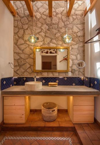 a bathroom with a sink and a mirror at Hotel Boutique Siete Soles in Pátzcuaro