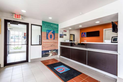 a hotel lobby with a detroit indianapolis colts mural at Motel 6-Bryan, TX - College Station in Bryan
