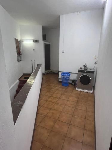an empty room with a kitchen and a microwave at Tourist Rendez Vous Hotel in Plaine Magnien