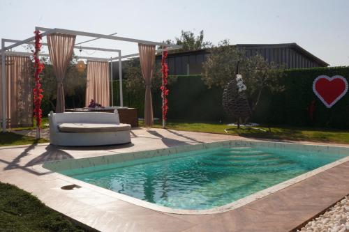 a swimming pool in a yard with a table at ON2 Bungalov Villas in Dosemealti
