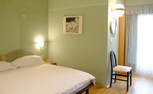En eller flere senge i et værelse på Hotel Sparerhof