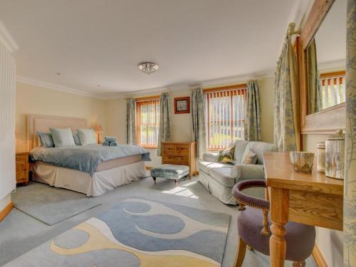 a bedroom with a bed and a living room at 4 Bed in Llandudno Junction oc-58301 in Llandudno Junction