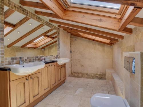 a bathroom with a sink and a toilet at 4 Bed in Llandudno Junction oc-58301 in Llandudno Junction