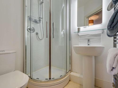 a bathroom with a shower and a sink at 4 Bed in Bude oc-ssham in Stratton