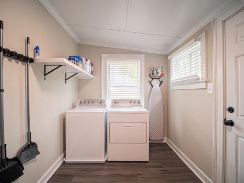 a laundry room with a washer and dryer in it at Marietta Square's Home Away! in Marietta