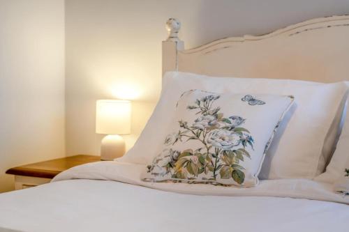 a white bed with a pillow on top of it at 2 Bed in Bembridge oc-p34174 in Bembridge