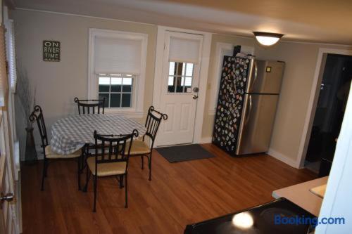 a kitchen with a table and chairs and a refrigerator at North Creek All Season Rental in North Creek