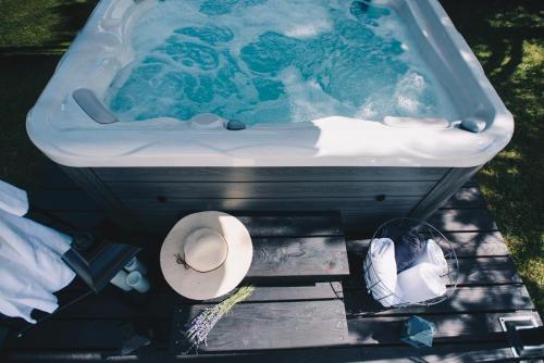 a bath tub with a toilet at GuestHouse Jagic in Plitvička Jezera