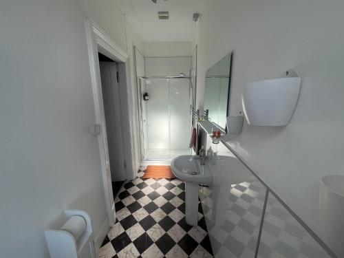 a bathroom with a toilet and a sink and a shower at Period House Auldcastle Road Crown in Inverness